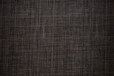 arka plan olarak koyu gri kumaş dokusu