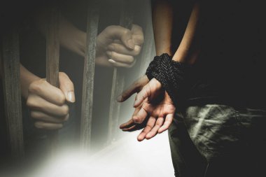 a woman tie up with rope, human trafficking concept