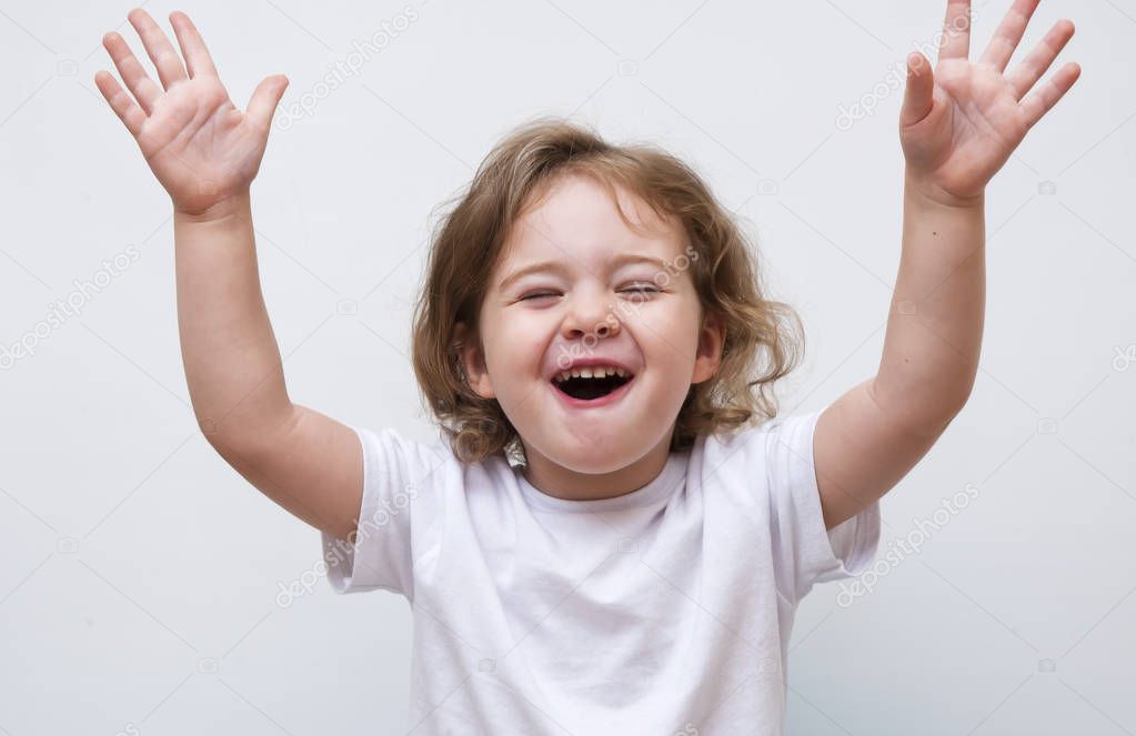 Young smiling girl holding hands up