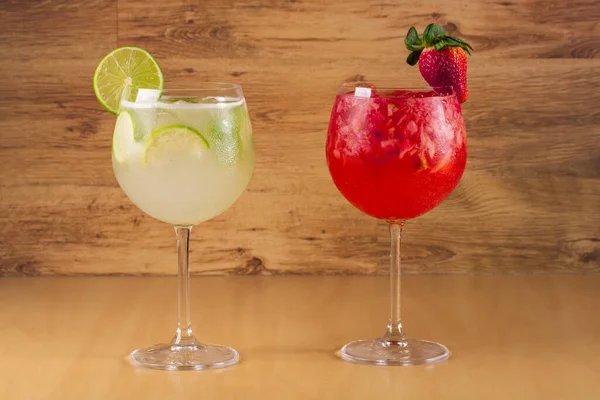 gin cocktail with fruits on wooden background