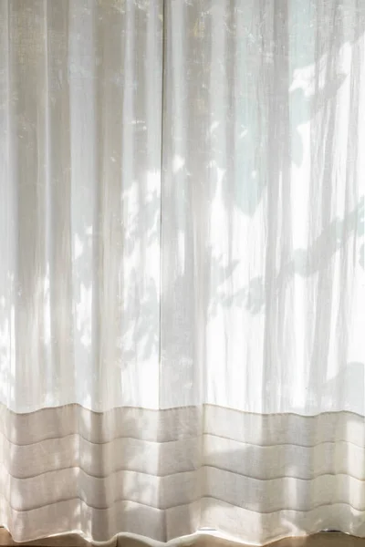 white curtain with morning light. Transparent curtain on window. Curtain background