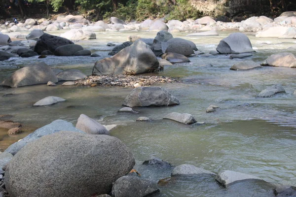 Large stones in the river in West Java in Indonesia