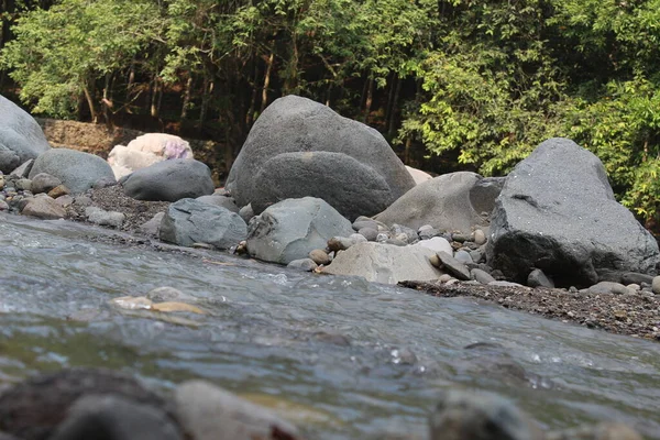 Large stones in the river in West Java in Indonesia