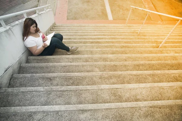 Portrait Pretty Asian Smiley Fat Woman Sit Writing Booklet Staircase — Stock Photo, Image