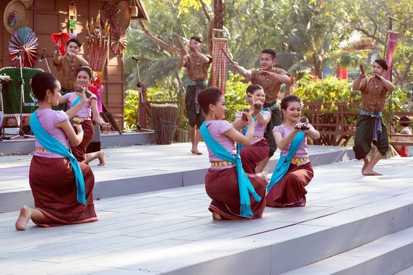 Outdoor Thai dancer is Northeastern traditional Thai dancing on platform in Participants take part in the celebration of Thailand tourism Festival. — Stock Photo, Image