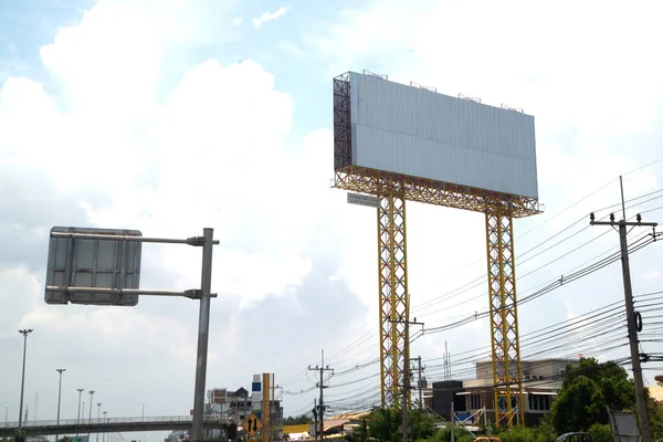 Large gray outdoor advertising signs on the side of the highway or billboard is blank at noon for advertising.