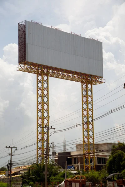 Large gray outdoor advertising signs on the side of the highway or billboard is blank at noon for advertising.