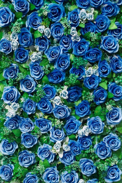 Paper roses background image, a wall decorated with blue colorful flowers.