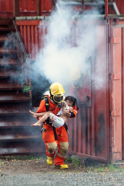 Firefighter Helping Girl Leave Burning Smoky Building — Stock Photo, Image