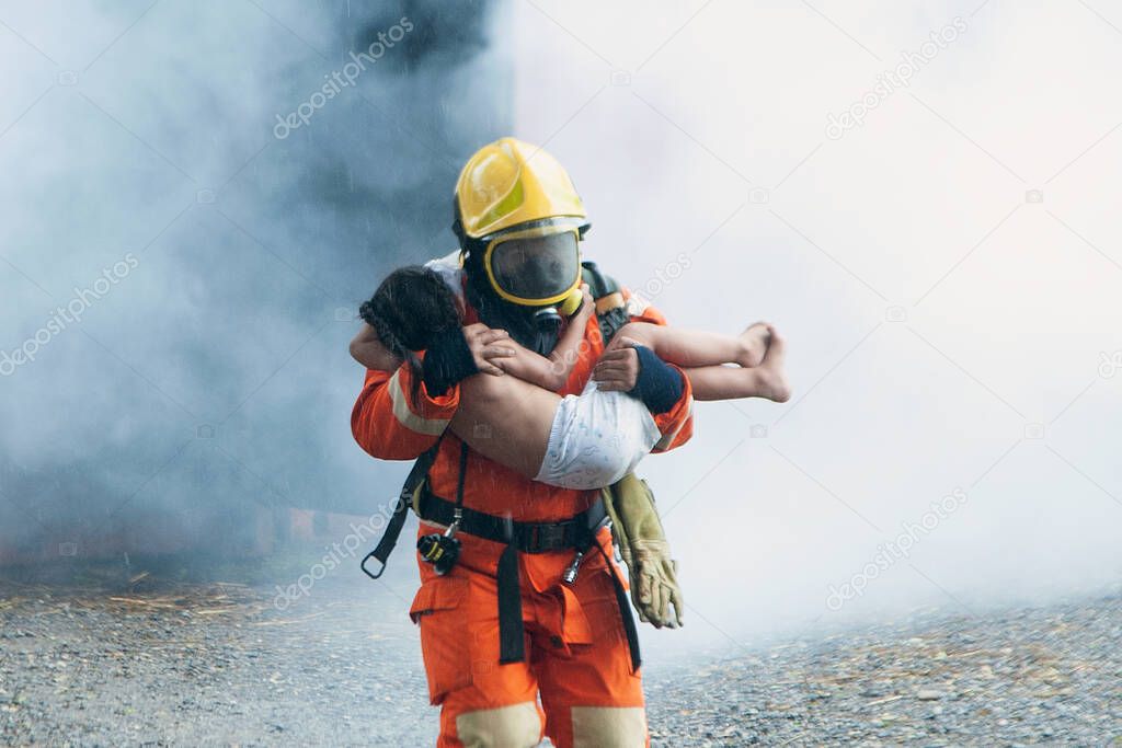 The firefighter was helping the girl. Leave the burning and smoky building. 