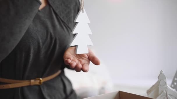 Woman packs gifts for new year decorations — Stock Video