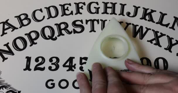 Hands Ouija Game Piece Spelling Hello Board Stock Video