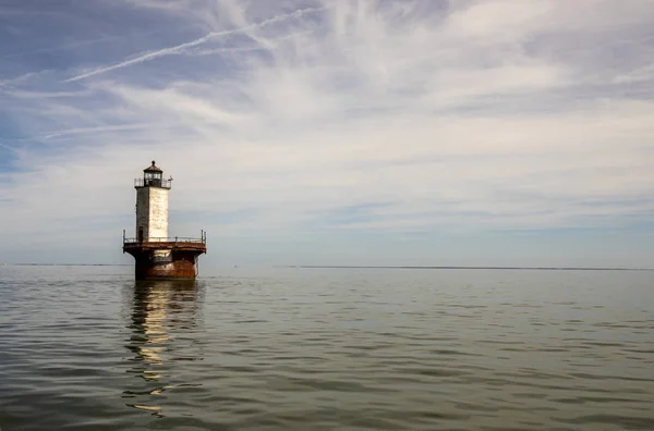 Solomons Lump Lighthouse reflecting in Chesapeake Bay landscape — Stock Image Solomons Lump Lighthouse reflecting in Chesapeake Bay landscape Royalty Free Stock Images