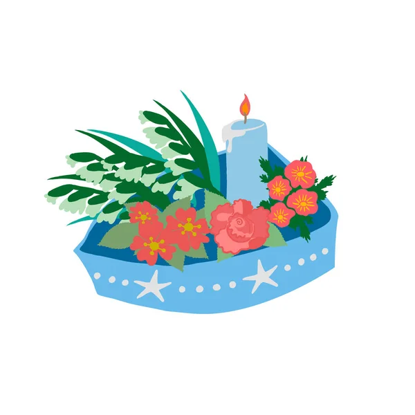 A little boat of offerings to sea goddess. Brazilian New Years Eve tradition. A blue boat decorated with stars and pearls, with red and white flowers and a light blue candle burning, isolated on white background.