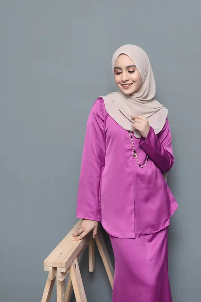 Hijab fashion.Cute Muslim girl wearing Hijab and traditional cloth.Fashion for eid celebration.