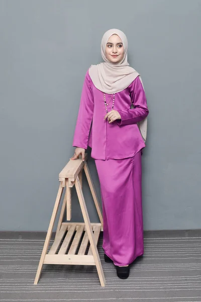 Hijab fashion.Cute Muslim girl wearing Hijab and traditional cloth.Fashion for eid celebration.