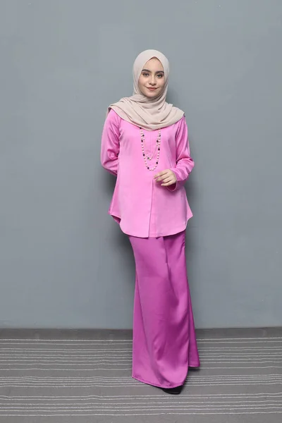 Hijab fashion.Cute Muslim girl wearing Hijab and traditional cloth.Fashion for eid celebration.