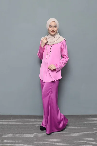 Hijab fashion.Cute Muslim girl wearing Hijab and traditional cloth.Fashion for eid celebration.