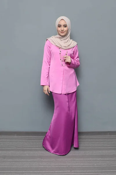 Hijab fashion.Cute Muslim girl wearing Hijab and traditional cloth.Fashion for eid celebration.