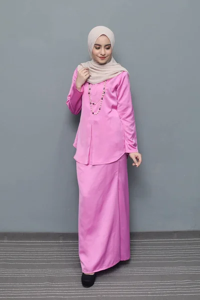 Hijab fashion.Cute Muslim girl wearing Hijab and traditional cloth.Fashion for eid celebration.