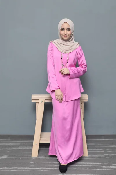 Hijab fashion.Cute Muslim girl wearing Hijab and traditional cloth.Fashion for eid celebration.