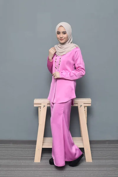 Hijab fashion.Cute Muslim girl wearing Hijab and traditional cloth.Fashion for eid celebration.