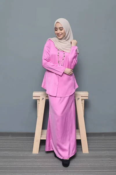 Hijab fashion.Cute Muslim girl wearing Hijab and traditional cloth.Fashion for eid celebration.