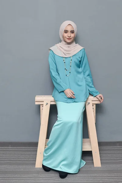 Hijab fashion.Cute Muslim girl wearing Hijab and traditional cloth.Fashion for eid celebration.