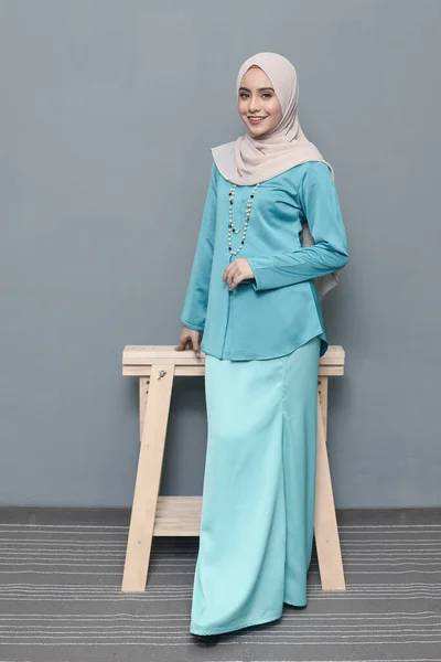 Hijab fashion.Cute Muslim girl wearing Hijab and traditional cloth.Fashion for eid celebration.