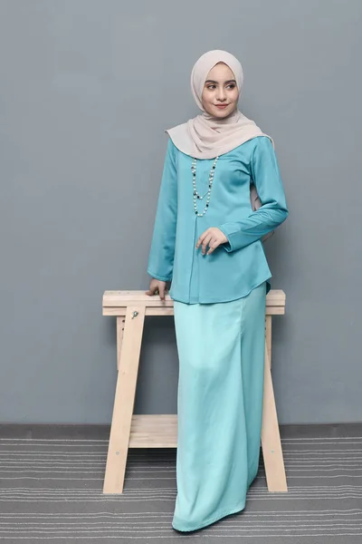 Hijab fashion.Cute Muslim girl wearing Hijab and traditional cloth.Fashion for eid celebration.