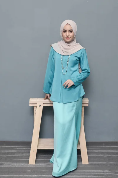 Hijab fashion.Cute Muslim girl wearing Hijab and traditional cloth.Fashion for eid celebration.