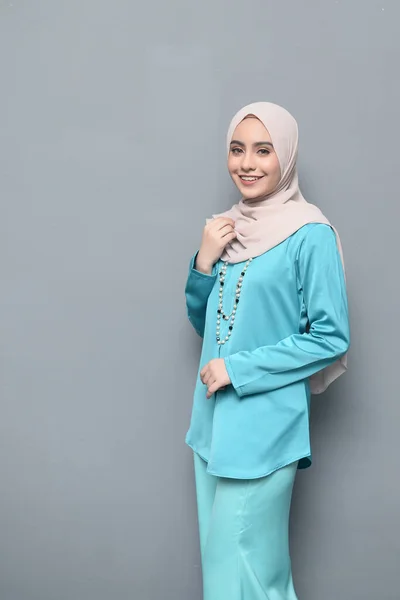 Hijab fashion.Cute Muslim girl wearing Hijab and traditional cloth.Fashion for eid celebration.