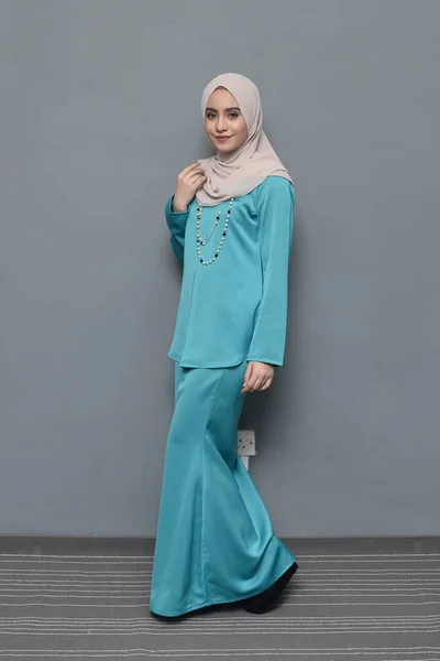 Hijab fashion.Cute Muslim girl wearing Hijab and traditional cloth.Fashion for eid celebration.