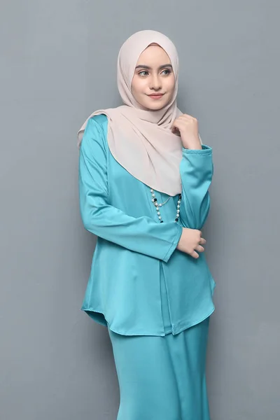 Hijab fashion.Cute Muslim girl wearing Hijab and traditional cloth.Fashion for eid celebration.