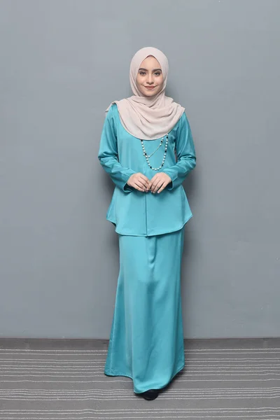 Hijab fashion.Cute Muslim girl wearing Hijab and traditional cloth.Fashion for eid celebration.