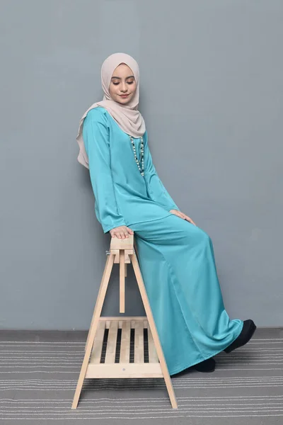 Hijab fashion.Cute Muslim girl wearing Hijab and traditional cloth.Fashion for eid celebration.