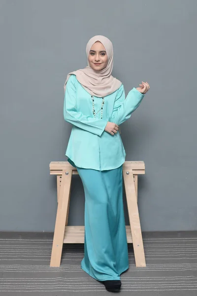 Hijab fashion.Cute Muslim girl wearing Hijab and traditional cloth.Fashion for eid celebration.