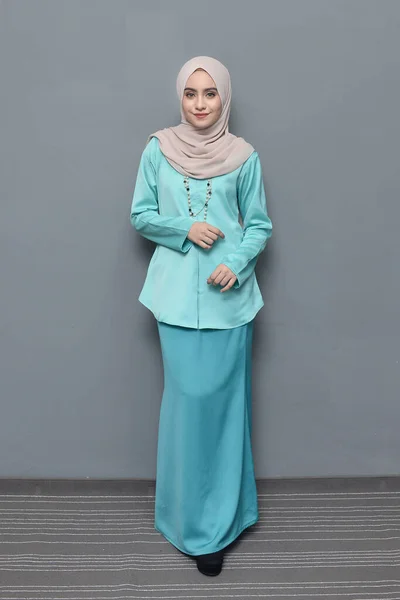 Hijab fashion.Cute Muslim girl wearing Hijab and traditional cloth.Fashion for eid celebration.