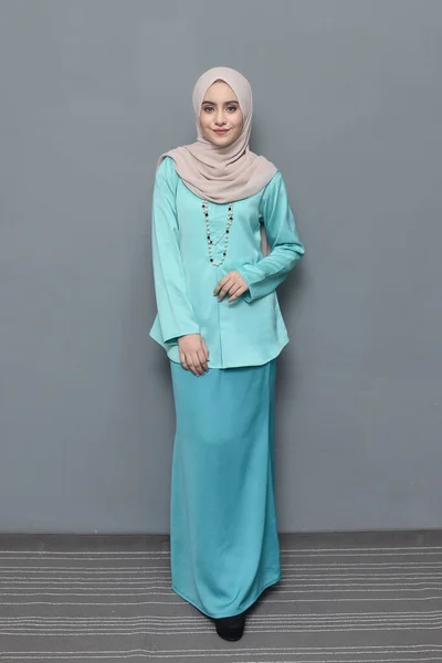 Hijab fashion.Cute Muslim girl wearing Hijab and traditional cloth.Fashion for eid celebration.