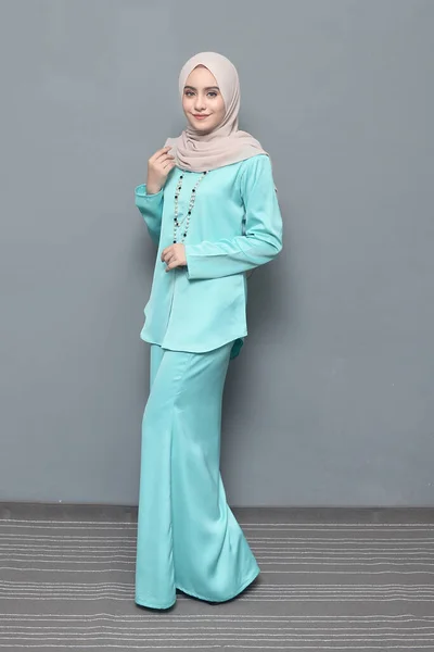 Hijab fashion.Cute Muslim girl wearing Hijab and traditional cloth.Fashion for eid celebration.