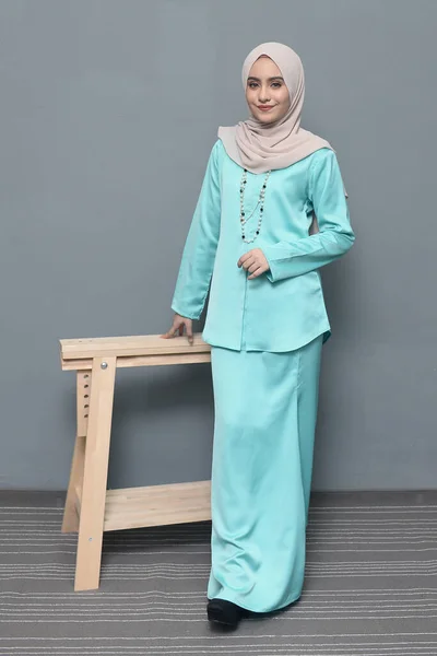 Hijab fashion.Cute Muslim girl wearing Hijab and traditional cloth.Fashion for eid celebration.