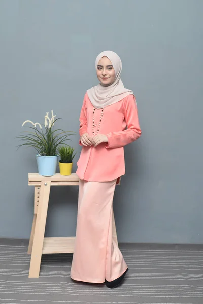 Hijab fashion.Cute Muslim girl wearing Hijab and traditional cloth.Fashion for eid celebration.