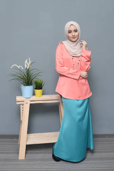 Hijab fashion.Cute Muslim girl wearing Hijab and traditional cloth.Fashion for eid celebration.