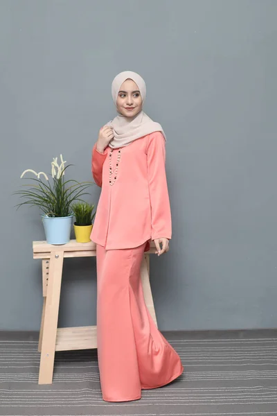 Hijab fashion.Cute Muslim girl wearing Hijab and traditional cloth.Fashion for eid celebration.