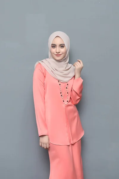 Hijab fashion.Cute Muslim girl wearing Hijab and traditional cloth.Fashion for eid celebration.