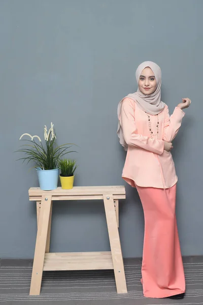 Hijab fashion.Cute Muslim girl wearing Hijab and traditional cloth.Fashion for eid celebration.