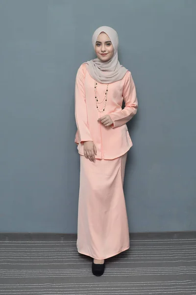 Hijab fashion.Cute Muslim girl wearing Hijab and traditional cloth.Fashion for eid celebration.