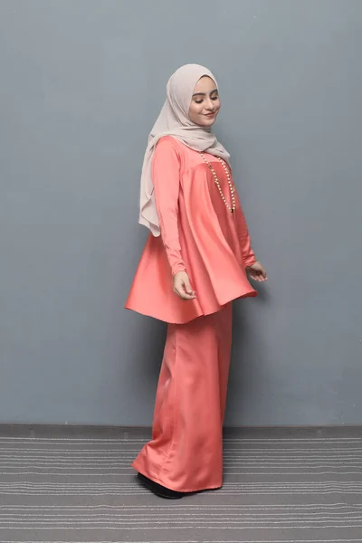 Hijab fashion.Cute Muslim girl wearing Hijab and traditional cloth.Fashion for eid celebration.