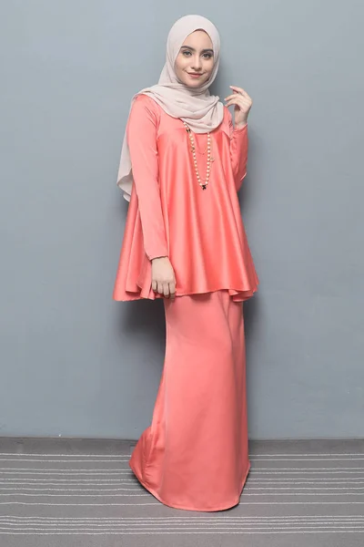 Hijab fashion.Cute Muslim girl wearing Hijab and traditional cloth.Fashion for eid celebration.