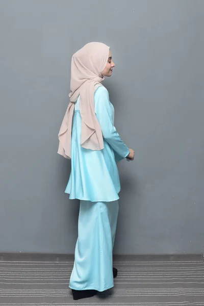 Hijab fashion.Cute Muslim girl wearing Hijab and traditional cloth.Fashion for eid celebration.